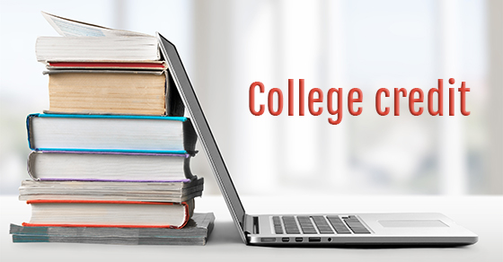 A side view of a laptop leaning against a stack of 8 large books with the text "College Credit" written in red next to the laptop.
