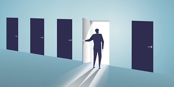 An animation of five dark doors, with a man opening up the fourth door and standing in front of its light.