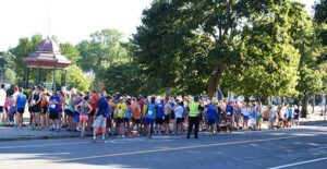 An image of a large crowd of runners at the start of a 5K line in 2016.