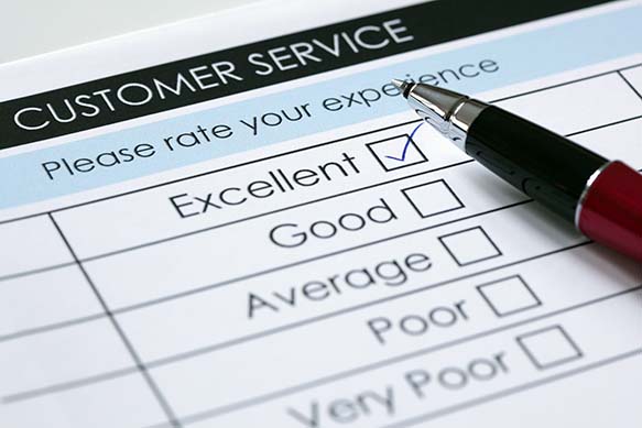 An up-close view of a customer service flier, where the box for excellent customer service is checked off.